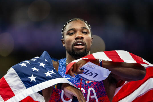 Noah Lyles of USA celebrates
