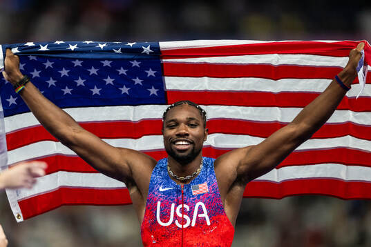 Noah Lyles of USA celebrates