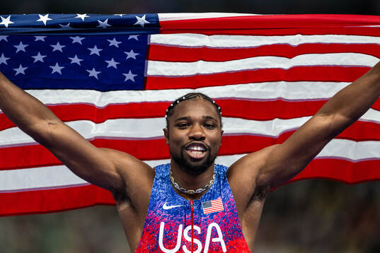 Noah Lyles of USA celebrates
