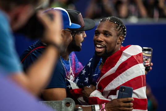 Noah Lyles of USA celebrates