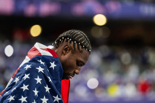 Noah Lyles of USA celebrates