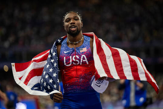 Noah Lyles of USA celebrates