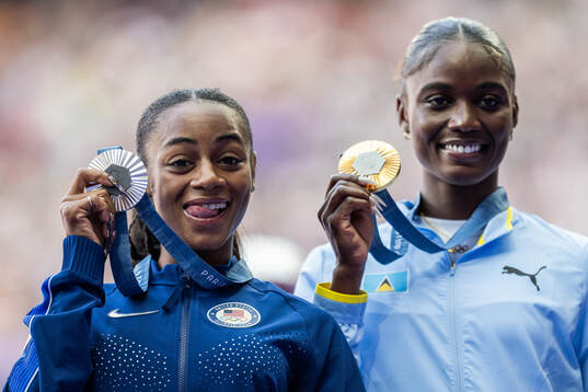 Sha'carri Richardson of USA (silver) and Julien Alfred of