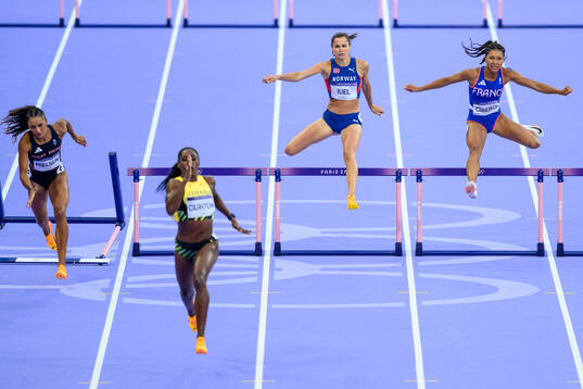 Lina Nielsen of Great Britain falls when competing against
