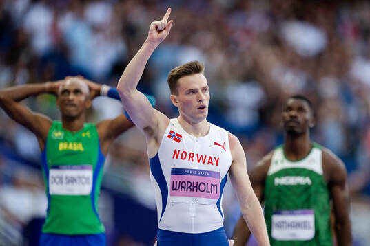Karsten Warholm of Norway celebrates