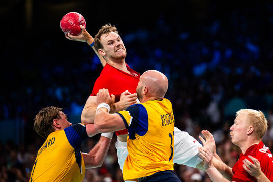 Mathias Gidsel of Denmark against Jonathan Carlsbogård and