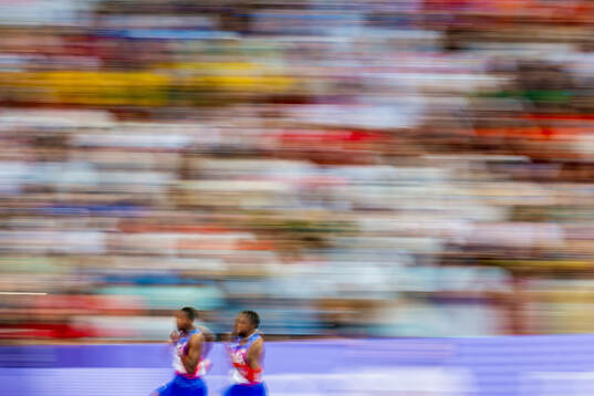 Erriyon Knighton and Noah Lyles of USA compete in men’s