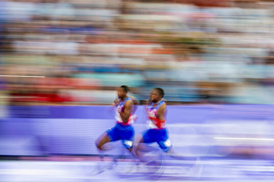 Erriyon Knighton and Noah Lyles of USA compete in men’s