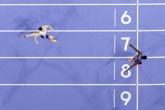 Karsten Warholm of Norway and Rai Benjamin of USA compete