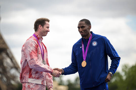 Derek Drouin of Canada and Erik Kynard of USA receives