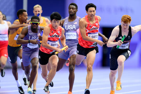 Kentaro Sato and Fuga Sato of Japan compete in men’s