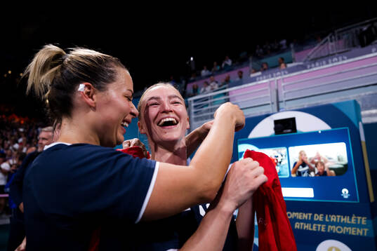 Nora Mørk and Stine Bredal Oftedal of Norway celebrate