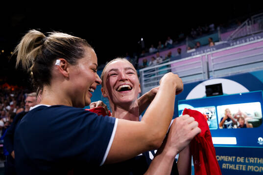 Nora Mørk and Stine Bredal Oftedal of Norway celebrate