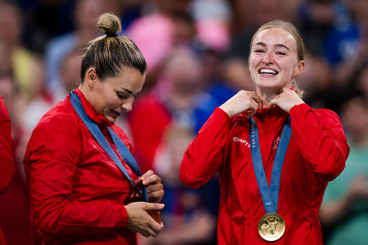 Nora Mørk and Stine Bredal Oftedal of Norway celebrate