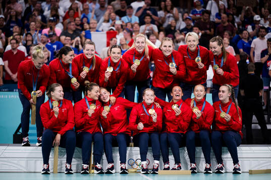 Players of Norway celebrate their gold at the medal ceremony