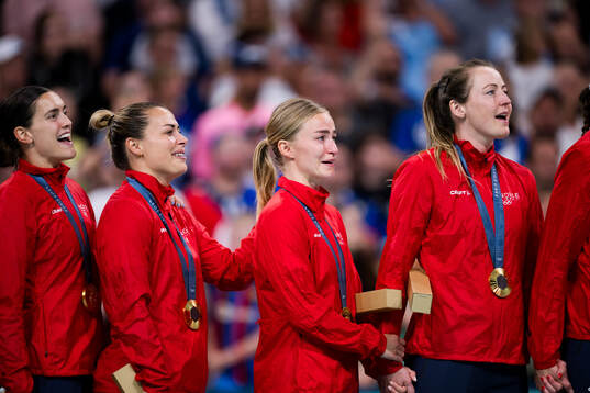 Nora Mørk and Stine Bredal Oftedal of Norway their gold
