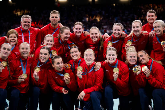 Players of Norway celebrate their gold at the medal ceremony