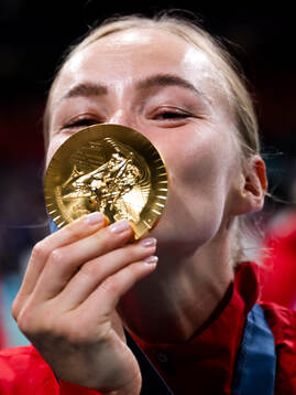 Stine Bredal Oftedal of Norway celebrates with her gold