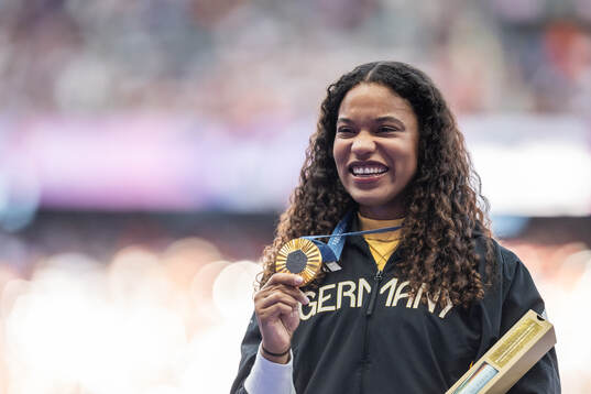 Gold medallist Yemesi Ogunleye of Germany celebrates