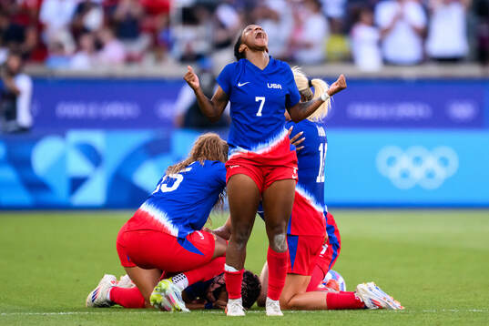 Crystal Dunn of USA celebrates