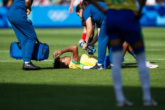 Vitoria Yaya of Brazil lies down due to injury in the