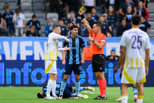 Josip Ilicic of Maribor receives a yellow card from referee