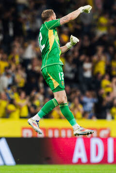 Goalkeeper Viktor Johansson of Sweden celebrate