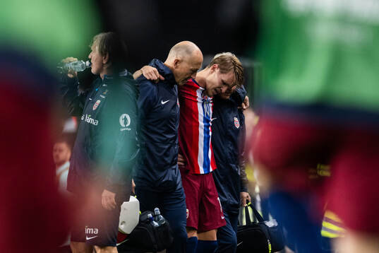 Martin Ødegaard of Norway leaves the pitch due to injury