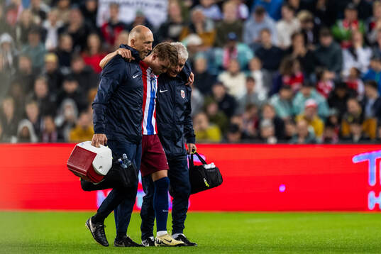 Martin Ødegaard of Norway leaves the pitch due to injury
