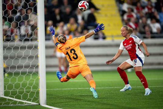 Goalkeeper Jennifer Falk of Häcken and Beth Mead of Arsenal