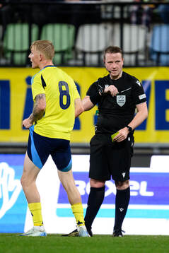 Melker Widell of Sweden reacts against Referee  Iwan Arwel