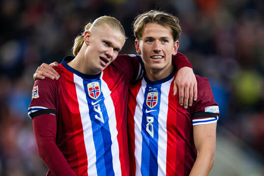 Erling Braut Haaland and Sander Berge of Norway celebrate