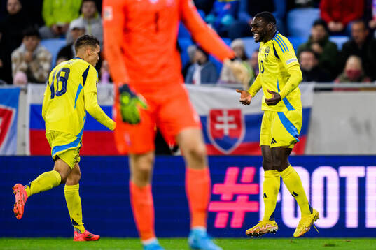 Yasin Ayari and Ken Sema of Sweden celebrate