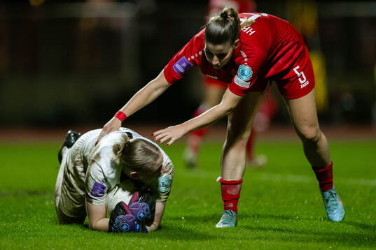 Goalkeeper Lucie Schlime and Emma Kramer of Luxembourg