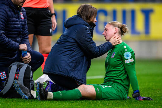 goalkeeper Lucie Schlime of Luxembourg recieves medical