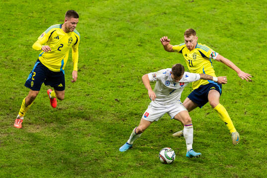 Tomas Suslov of Slovakia and Emil Holm and Dejan Kulusevski