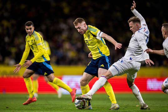 Dejan Kulusevski of Sweden and Ondrej Duda of Slovakia