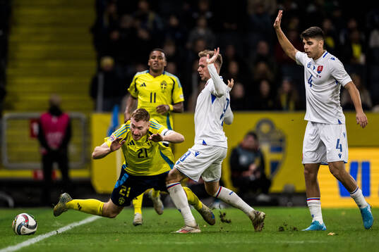 Dejan Kulusevski of Sweden and Ondrej Duda of Slovakia