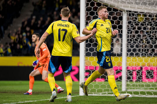 Dejan Kulusevski of Sweden celebrates with Viktor Gyökeres