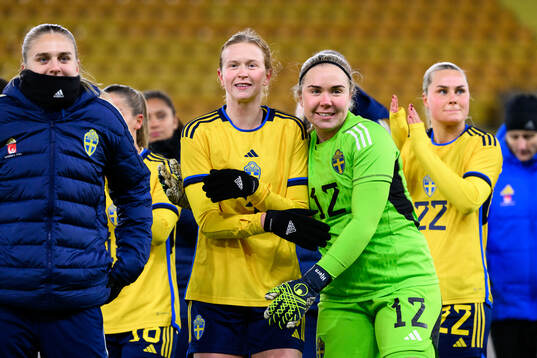 Emma Östlund and goalkeeper Sofia Hjern of Sweden celebrate