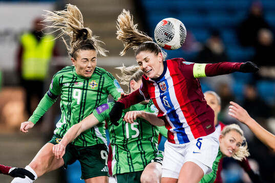 Simone Magill of Northern Ireland and Maren Mjelde of Norway