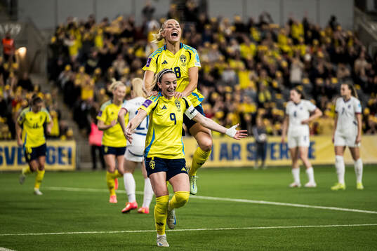 Kosovare Asllani and Fridolina Rolfö of Sweden celebrating