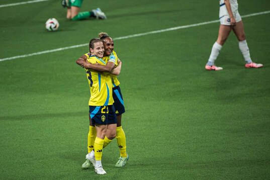 Anna Anvegård and Madelen Janogy of Sweden celebrating the
