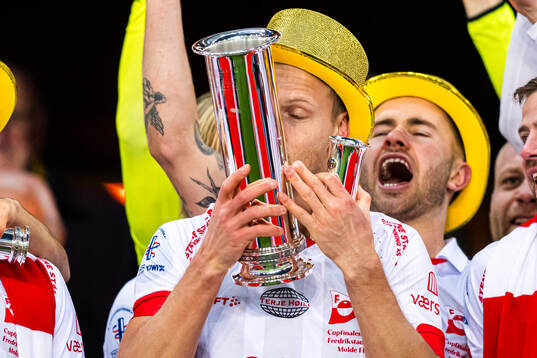 Morten Bjørlo of Fredrikstad celebrates with the trophy