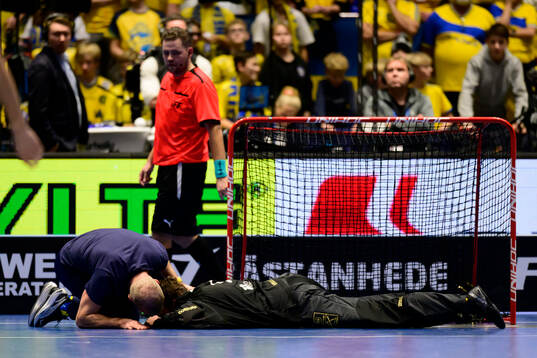 Goalkeeper Jon Hedlund of Sweden in pain