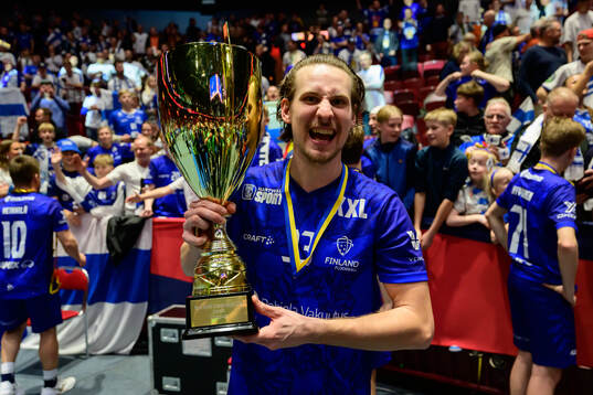 Miska Makinen of Finland celebrates with the trophy