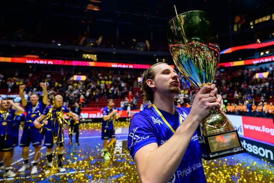 Miska Makinen of Finland celebrates with the trophy