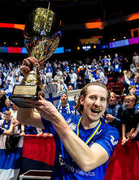 Miska Makinen of Finland celebrate with the trophy