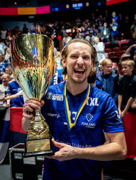 Miska Makinen of Finland celebrates with the trophy