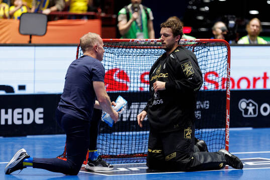 Goalkeeper Jon Hedlund of Sweden in pain